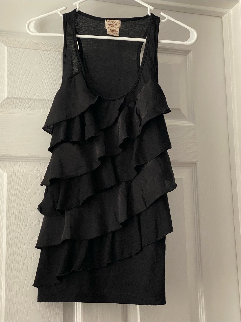 eyelash couture Black Top with Cream Label Detail